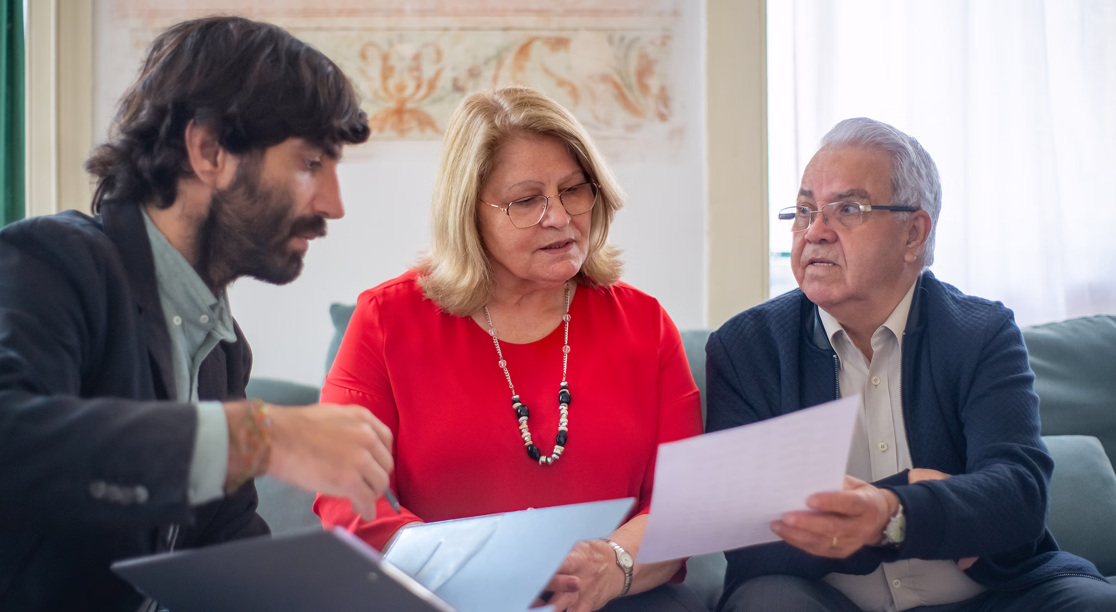 Adult siblings reviewing documents inside an inherited San Antonio house
