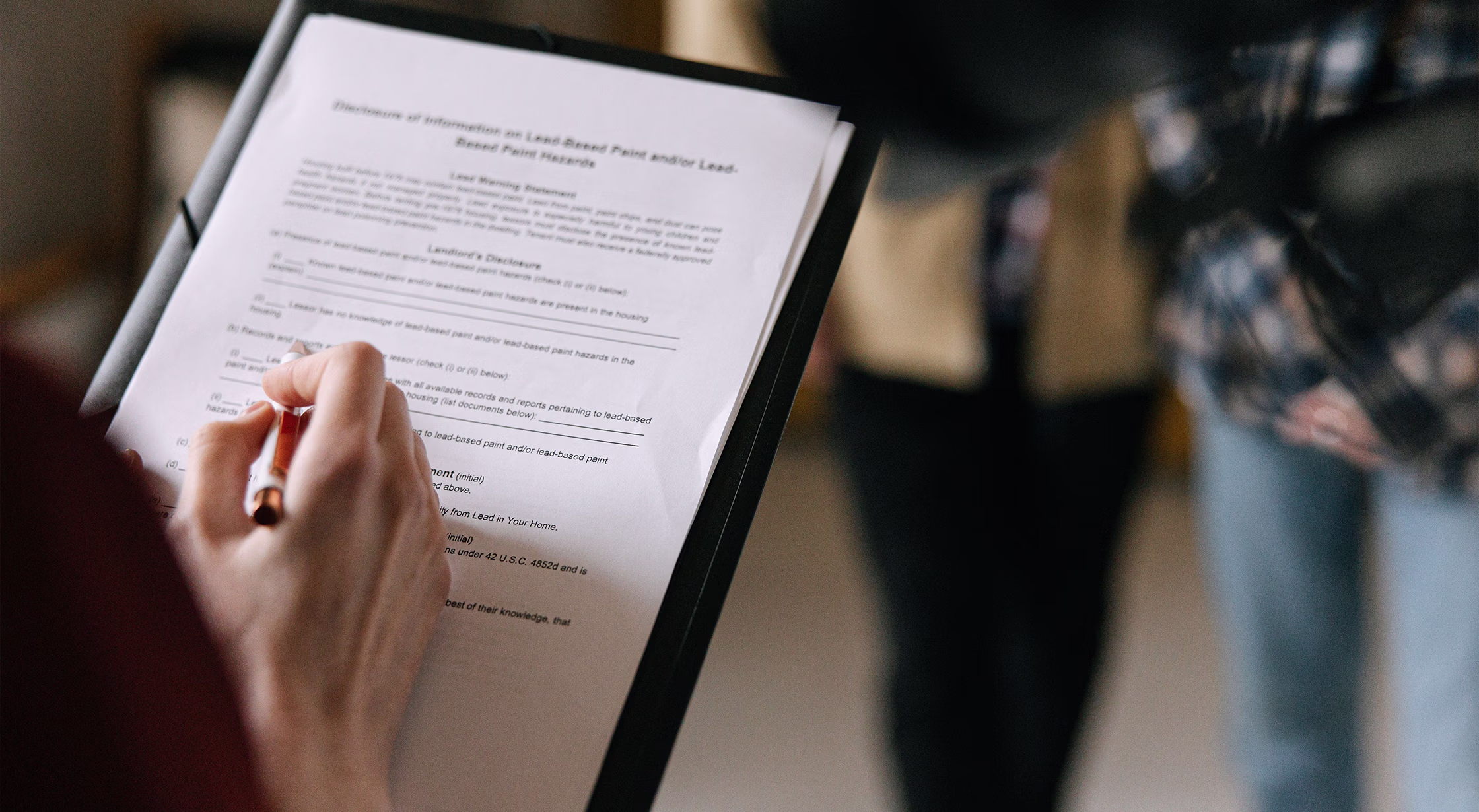 San Antonio landlord reviewing a lease before selling a tenant-occupied rental